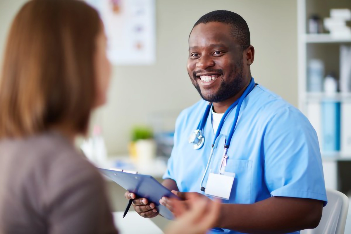 Image shows a clinican with a patient
